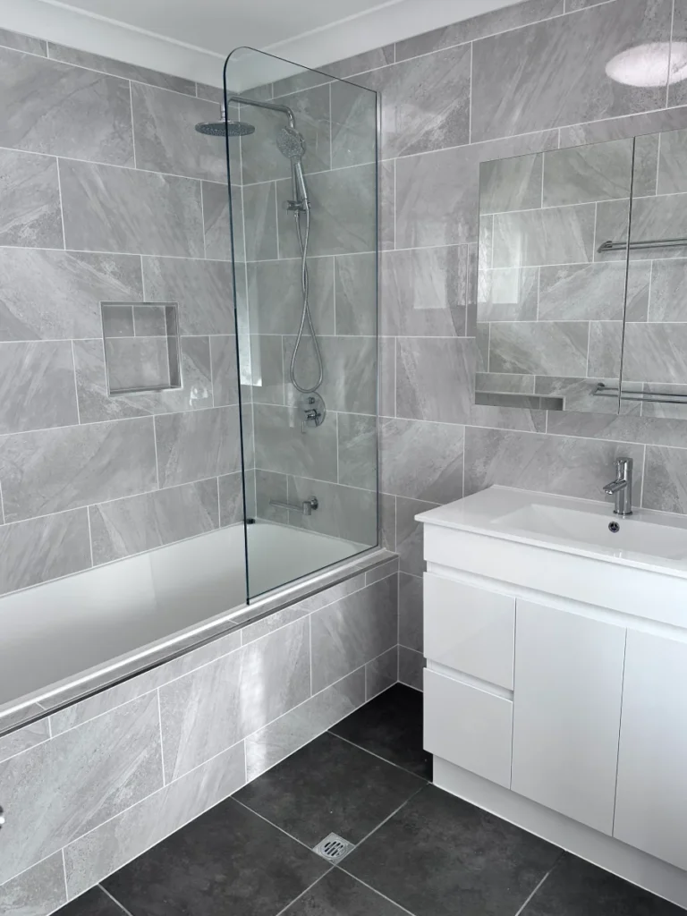 Grey and white timeless bathroom, finished with chrome